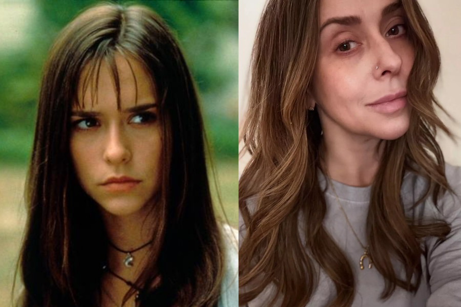 Side-by-side photos showing a woman as a teen and as an adult. On the left, she appears younger with straight dark hair and bangs, wearing layered chokers and a serious expression in a cinematic outdoor setting. On the right, she is older with soft waves in her hair, a nose piercing, and a subtle smile, wearing a casual grey shirt and gold jewelry in a selfie-style portrait.