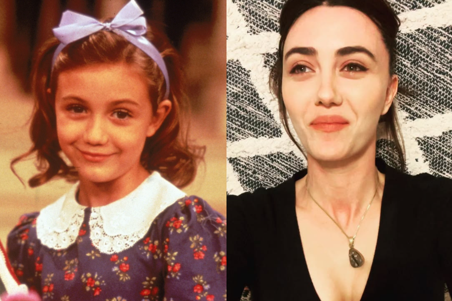 Side-by-side images of a woman as a child actress and as an adult. On the left, she is a young girl with curled brown hair, wearing a purple dress with a white lace collar and a lilac bow headband, smiling sweetly in a classic film or TV scene. On the right, she is grown up with dark hair pulled back, wearing a black top and pendant necklace, softly smiling in a casual selfie against a patterned background.
