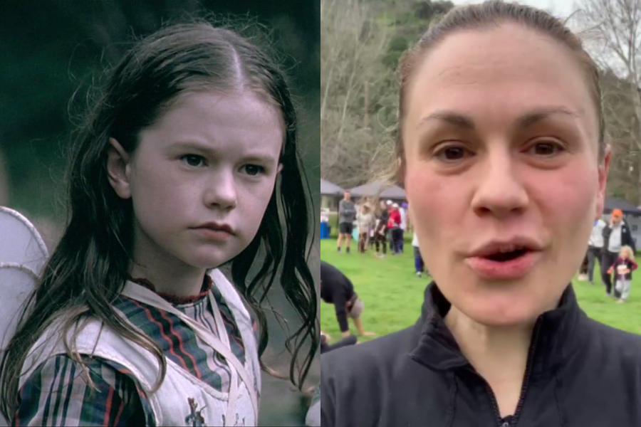 Side-by-side transformation of a woman. On the left, she’s a serious young girl with long wet-looking dark hair, dressed in a striped shirt and wearing fairy wings, from a film scene. On the right, as an adult, she’s outdoors at a park event, casually dressed in a black zip-up jacket with no makeup, speaking mid-sentence with people mingling in the blurred background.