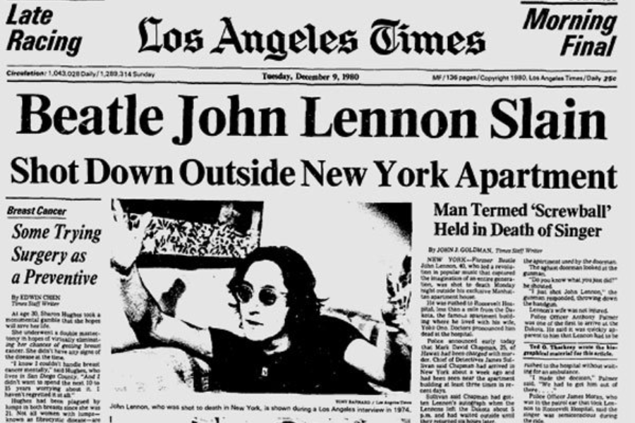 Black-and-white image of a historic Los Angeles Times newspaper front page from December 9, 1980. The headline reads, “Beatle John Lennon Slain — Shot Down Outside New York Apartment,” accompanied by a photo of John Lennon wearing sunglasses and raising his hand during an interview.